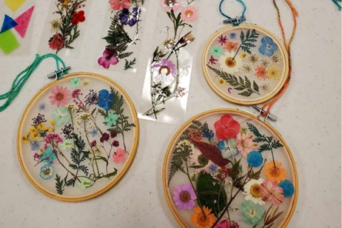 Pressed flowers in an embroidery hoop