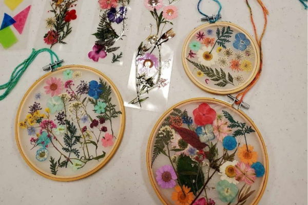 Pressed flowers in an embroidery hoop